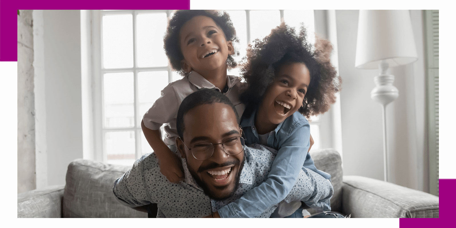 Laughing dad piggy backing kids at home
