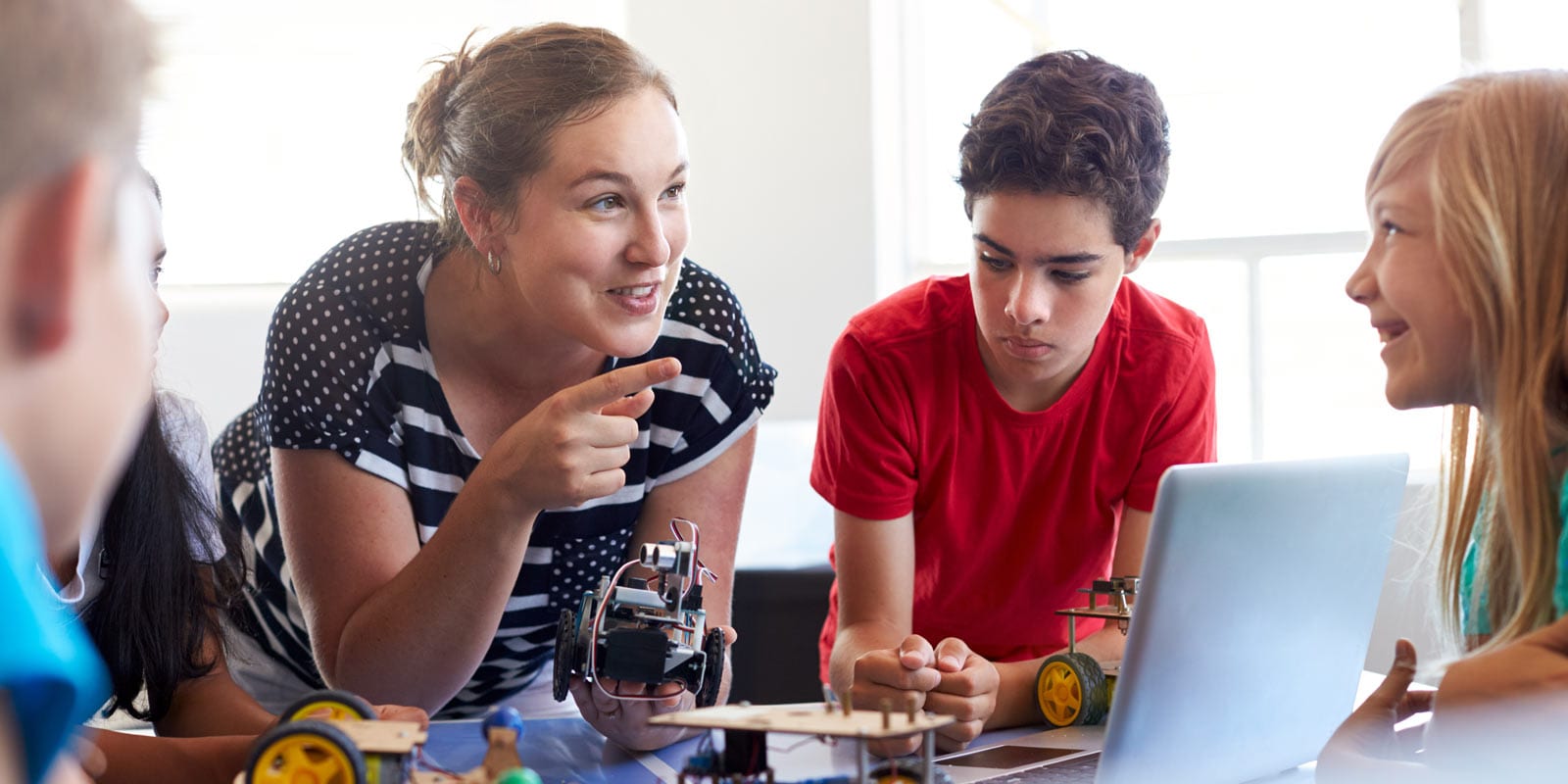 Students engaging with teacher in class