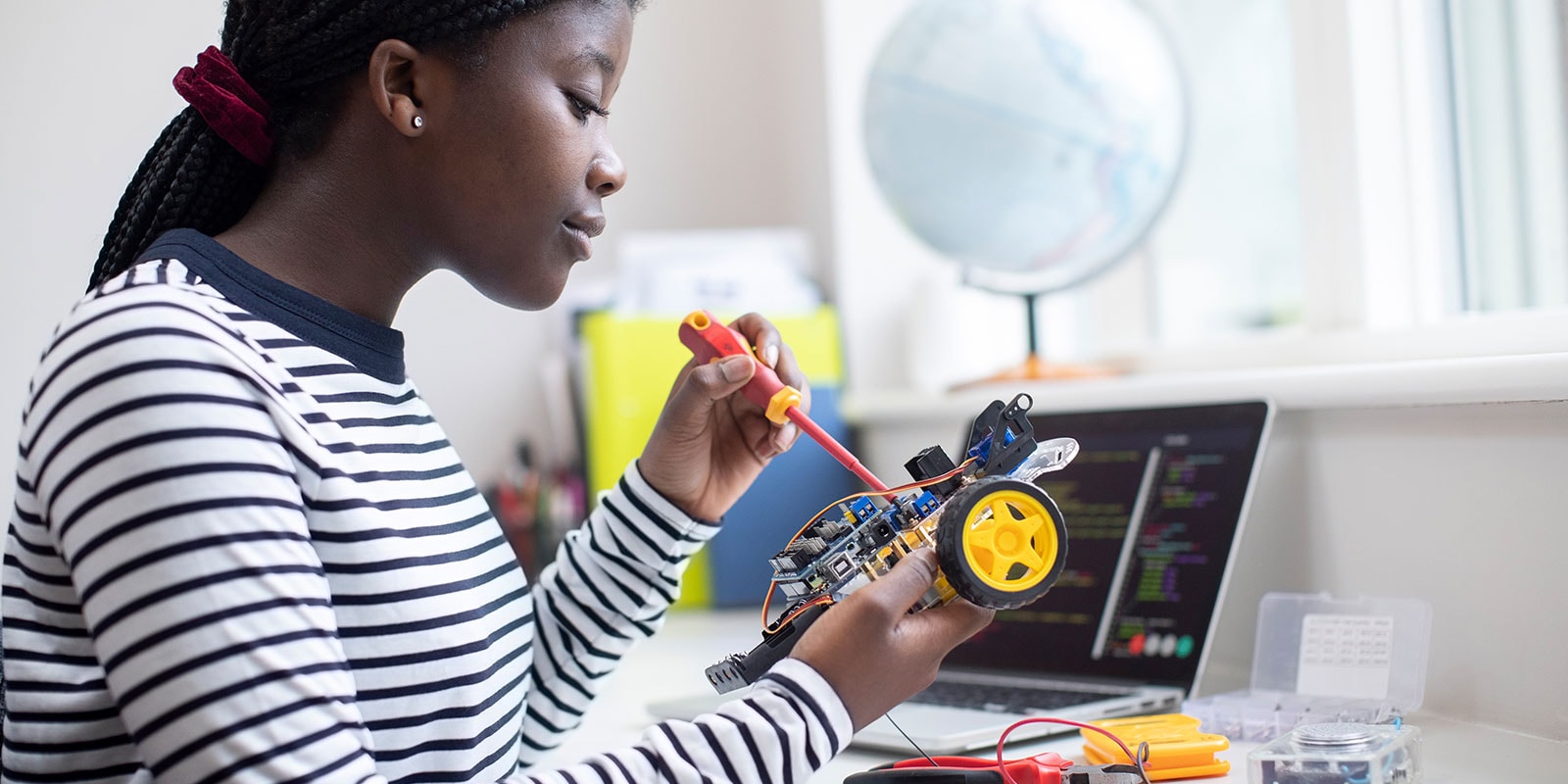 Student working with robotics