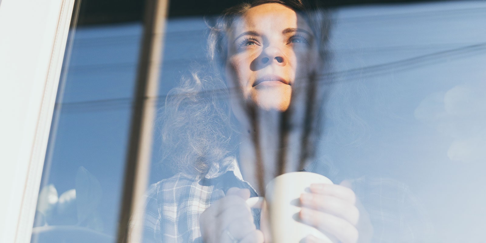 Woman gazing out of a window